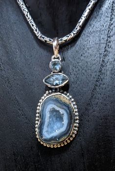 Expertly crafted and designed, this Druzy and Blue Topaz Pendant is a stunning addition to any jewelry collection. The combination of the sparkling Druzy stone and vibrant blue Topaz creates a striking and elegant look. Perfect for any occasion, this pendant is a must-have for those who appreciate high-quality, beautiful jewelry. 92.5 Sterling Silver, 1.75" L, Art Jewelry Necklace, Costumes Diy, Stone World, Blue Topaz Pendant, Topaz Pendant, Rock Collection, Metal Work, Vibrant Blue, Art Jewelry