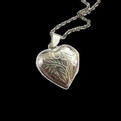 "PAJ engraved sterling silver heart locket on silver chain. Space for two photos. Circa 1960's. Marked \"PAJ Ster\". The locket is approximately 1.2\" inches long including the bail, and the chain is 20 inches long. The locket is made of frosted sterling silver, and the chain is sterling silver. Both are in very good vintage condition. I also have the same locket available without a chain. A lovely Valentine's Day, Anniversary, Birthday, Mother's Day gift for that special someone. Contact me for combined shipping, or a Canada Post rate." Vintage Engraved Double Heart Necklace, Vintage Double Heart Engraved Necklace, Vintage Sterling Silver Engraved Locket Necklace, Vintage Double Heart Engraved Locket Necklace, Vintage Engraved Sterling Silver Locket Necklace, Classic Engraved Double Heart Jewelry, Classic Double Heart Engraved Jewelry, Vintage Silver Jewelry For Valentine's Day, Classic Heart Jewelry For Collectibles