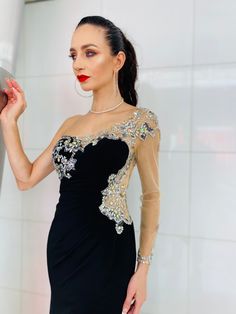 Description: The “Darcy” one shoulder gown! Sheer Bodice with a touch of Bling. A Must for that next Special Event. Style with your favorite heels and matching clutch for the evening. Model is 5.8"/size 2 and wearing size 4 or XS in the picture. All merchandise ship from United States. Please email info@danielleemon.com for additional sizes and colors. Product Details: Style: One Shoulder Hand Beaded Semi-Ball Gown Length: Long Fabric: 100% Polyester Fully Lined Closure: Hidden Side Zipper Care 2022 Jewelry, One Shoulder Gown, Trends 2022, Hand Beading, Mermaid Formal Dress, Special Events, Ball Gowns, Bodice, One Shoulder