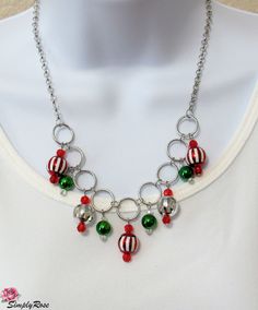 This festive 18 inch necklace features hanging Christmas ornaments, providing sparkle when you move! This would make a great Christmas gift or purchase for yourself for your holiday gala event. Holiday Party Silver Necklaces, Holiday Party Silver Necklace, Handmade Christmas Necklaces For Festive Occasions, Festive Red Christmas Necklaces, Silver Holiday Necklaces For Festive Occasion, Silver Holiday Necklace For Festive Occasion, Silver Christmas Party Necklace, Silver Necklace For Christmas Celebration, Silver Necklace For Christmas Party