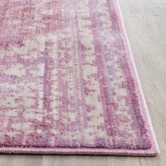 a pink and white rug on the floor