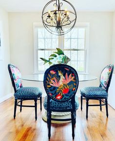 a dining room table with chairs and a chandelier