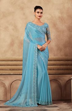 COLOR : Sky Blue FABRIC : Saree - Chiffon Silk, Blouse - Chiffon Silk & Net WORK : Resham Embroidery, Stones, Sequins, Lace BorderOCCASION : Wedding, Engagement, Party Wear, Festival, Sangeet NOTE : The outfit includes blouse and saree only. Petticoat is not included. READY-TO-WEAR : No STITCHING : Available as semi-stitched fabric, can be stitched using standard size option (+$30). Note: There might be a slight color variation due to lighting and flash used during photoshoot. The bright shade seen is the best closer view of fabric's color. Blue Dori Work Saree For Reception, Blue Saree With Dori Work For Reception, Wedding Saree Blouse Piece In Blue, Wedding Saree In Light Blue With Cutdana, Blue Blouse Piece For Wedding Saree, Wedding Blouse Piece For Saree In Blue, Light Blue Saree For Reception And Diwali, Light Blue Zari Work Saree For Reception, Blue Floor-length Saree For Reception