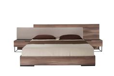 a bed with a wooden headboard and two pillows on top of it, in front of a white background