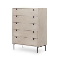 a white dresser with four drawers and black handles