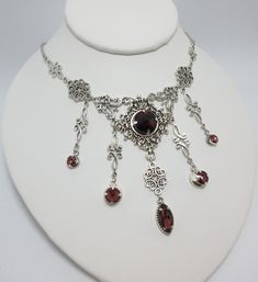 "This is a new handmade necklace. It is made with antiqued silver plated filigrees, accented with high quality AMETHYST PURPLE glass jewels/rhinestones that sparkle like crystals. Decorated portion is 6 1/2\" wide and 3 1/4\" tall in the center. Necklace is adjustable 15-18\" with a lobster clasp and chain extender. If you would like a different length, please send us a message. Matching earrings and headpiece are listed in our store." Dress References, Medieval Steampunk, Fantasy Jewellery, Goth Things, Steampunk Goth, Purple Gothic, Antique Silver Necklace, Goth Jewelry, Choker Pendant