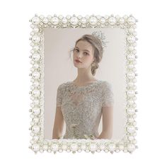 a woman wearing a tiara with pearls around her neck in a white photo frame