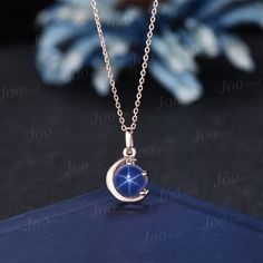 The moon engagement pendant necklace are a popular choice, represents I LOVE YOU TO THE MOON AND BACK , used to express the vastness of one's affection for another. HOW TO STYLE : it is the most versatile and elegant statement necklace for casual days in the office and nights out. It's your go-to statement piece whatever the occasion. It also can be personalized to show your uniqueness in the party, date, banquet. PERFECT FOR GIFTING: This star blue sapphire necklace is classic and never go out of style,  packaged in delicated gift box , It's a good choice of an anniversary, engagement, birthday, Mother's Day gifts, Christmas day, Thanksgiving Day, Valentine's Day gift for a couple, friend, family. AFTER-SALE SERVICE : 30 days money-back guarantee and for any reason, you are not satisfied Blue Star Necklace, Blue Clavicle Chain Necklace For Wedding, Elegant Blue Moon Phase Necklace, Elegant Blue Jewelry With Moon Charm, Elegant Blue Moon-shaped Jewelry, Celestial Blue Round Pendant Jewelry, Blue Celestial Round Pendant Jewelry, Blue Moon Phase Round Pendant Jewelry, Elegant Blue Moon-shaped Necklace