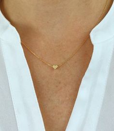 "Dainty necklace, gold Heart necklace, gold necklace, Dainty jewelry, gift for her, simple necklace, gift for women, dainty necklace, birthday gift for her Simple and dainty gold heart necklace. D E T A I L S: *5mm tiny gold plated heart *18\" gold plated chain *Lobster clasp closure This style is also available in rose gold and silver in our shop! SHIPPING: *Free domestic shipping on all orders PACKAGING: *All pieces come beautifully packaged, perfect for gift giving. Find more to ❤️ here: http Dainty Small Heart Necklace For Everyday, Dainty Heart Pendant Charm Necklace For Everyday, Dainty Everyday Heart Pendant Charm Necklace, Simple Necklace With Heart Charm As A Gift, Minimalist Delicate Chain Charm Necklace For Valentine's Day, Minimalist Tiny Necklaces For Valentine's Day, Tiny Heart Necklace In Minimalist Style, Handmade Heart Necklace For Everyday Wear, Minimalist Handmade Heart Necklace For Everyday