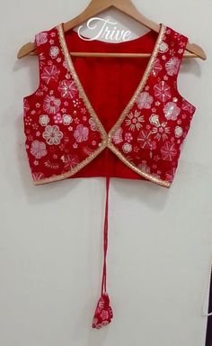 This Made to Order/Made to Measurement/Custom Made Indian Ethnic Blouse. - Fabric - Embroidered Georgette - Color  Red color - Princess Cut - Rich Lined - Shoulder string with latkans - Sleeveless - Extra margin and extra stitches included in the blouse - It can be customize in any color, design or size  MEAUREMENTS & CUSTOMIZATIONS This blouse can be purchased in your standard sizing and pattern. Please choose your Chest Size (measured in inches) from the drop-down box.. For custom sizing pleas Sleeveless Red Lehenga For Diwali, Red Sleeveless Bollywood Style Sets, Red Sleeveless Bollywood Set, Traditional Sleeveless Lehenga With Mirror Work, Embroidered V-neck Traditional Wear For Festivals, Red Sleeveless Zari Work Set, Red Sleeveless Lehenga With Zari Work, Sleeveless Red Sets With Zari Work, Red Sleeveless Sets With Zari Work