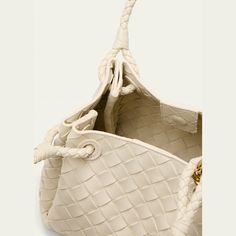 Bottega Veneta "Adiamo" parachute top handle bag in intrecciato leather  Shoulder straps with metal knot hardware  Open top with magnetic closure  Approx. 6.5"H x 8.3"W x 6.7"D Made in Italy Luxury Shoulder Bag With Interwoven Design And Double Handle, Luxury Shoulder Bag With Double Handle And Interwoven Design, Luxury Bags With Interwoven Design And Double Handle, Designer Top Handle Shoulder Bag With Interwoven Design, Chic Top Handle Shoulder Bag With Interwoven Design, Modern Bucket Bag With Intrecciato Weave And Double Handle, Modern Bucket Bag With Double Handle And Intrecciato Weave, Intrecciato Weave Top Handle Bucket Bag For Shopping, Intrecciato Weave Top Handle Bucket Bag