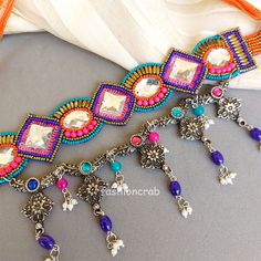 This Designer Multicolour Beads Oxidised Silver Handcrafted Afghan Choker Necklace for Girls is very much in high trend gives you a real indo western as well as royal look. This is a good quality bead choker set is ideal for all special occasions and functions like wedding, party, etc. This is a handcrafted choker with ... Dress Anarkali, Choker Necklace Online, Kundan Jewellery Bridal, Bold Statement Jewelry, Kundan Jewellery Set, Necklace For Girls, Western Necklaces, Saree Lehenga, Green Pendants