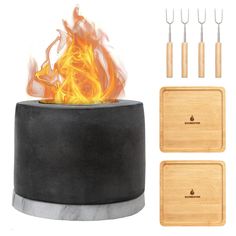 an outdoor fire pit with tongs and spatulas next to it on a white background