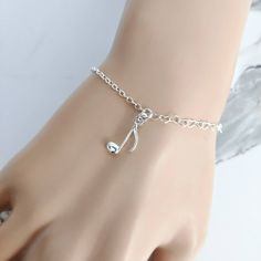 Sterling silver music note bracelet. Please note: photographs are taken close up. Please check details of the product below. 💗 925 sterling silver music note bracelet, 💗 size adjustable from 6.3 - 7.8 inches (15.5-19.5 cm), 💗 music note charm size : 16.5 x 8 mm, 💗 I use only the best quality EU sterling silver components, 💗 100% Nickel Free and hypoallergenic 💗 choose your bracelet - with or without Gift Box 💗 handmade with love  Please note: photographs are taken close up. The music note Music Note Accessories, Silver Music-themed Bracelet As Gift, Music-themed Silver Bracelet As A Gift, Silver Music-themed Bracelet For Gift, Music Note Bracelet, Silver Music-themed Bracelets For Gifts, Adjustable Silver Music-themed Bracelets, Adjustable Silver Music-themed Bracelet, Music Bracelet