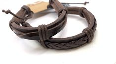 This set of two handcrafted  leather bracelets makes a great couple's gift. Handmade Casual Leather Bracelets, Casual Leather Bracelet As Gift, Casual Handmade Leather Bracelets, Casual Leather Jewelry As Gift, Adjustable Brown Leather Wristband, Adjustable Brown Leather Sweatband Wristband, Brown Adjustable Band Bracelet As Gift, Brown Adjustable Bracelets As Gift, Casual Leather Bracelet With Adjustable Cord