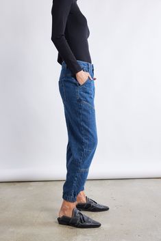 A new kind of denim pant: these relaxed fit pants are so comfortable they feel like loungewear. Made with a unique light denim fabric to fit in seamlessly with the rest of your wardrobe. Designed to have a jogger-style silhouette but look and feel like soft denim. Jogger style light denim fabric Elastic ankle cuff Elastic back waistband 2 back pockets, 2 side pockets Belt loops Button and zip front closure Casual Everyday Cropped Jeans With Pockets, Casual Medium Wash Tapered Cargo Jeans, Everyday Medium Wash Cargo Jeans, Relaxed Medium Wash Jeans With Pockets, Everyday Denim Cropped Leg Pants, Casual Tapered Leg Medium Wash Cargo Jeans, Relaxed Mid-rise Denim Jeans, Denim Blue Tapered Leg Cargo Jeans, Relaxed Fit Denim Pants With Tapered Leg