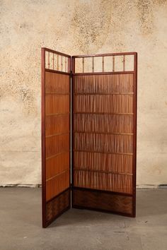 a room divider made out of wood and bamboo