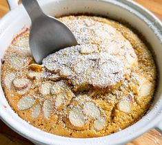 a spoon in a pot filled with food