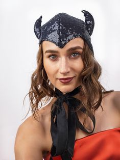 The headpiece features black sequin fabric and playful horns, making it a perfect addition to any costume.  One size fits most, head circumference- 22-23 inches.  Lightweight and comfortable to wear all night long. The bonnet is completely lines and has long ties, which you can tie into a bow, leave hanging like a scarf, or style however you like. Fits a variety of Halloween and Cosplay costumes. Pair it with your evening outfit and turn it into a Halloween or party costume with just one headpie Fantasy Winter Party Costumes, Halloween Cat Ears Costume Headpiece, Halloween Cat Ears Headpiece, Halloween Costume Cat Ears Headpiece, Halloween Cat Ears Costume Hats, Halloween Costume Accessories With Ears, Winter Costume Cat Ears Hats And Headpieces, Novelty Costume Hat With Cat Ears, Black Novelty Carnival Costume