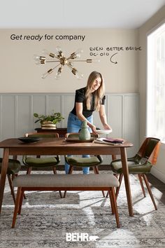 a woman standing in front of a dining room table