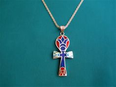 "Beautiful Large Egyptian Sterling Silver Ankh necklace inlayed with turquoise, Lapis Lazuli & coral stones in a form of Egyptian Lotus flower. The ankh is an ancient Egyptian hieroglyphic symbol that was most commonly used in writing and in art to represent the word for \"life\" and, by extension, as a symbol of life itself. The sign has a cross shape but with an oval loop in place of an upper bar.  It signified wisdom and insight on the highest level and it was also a fertility symbol. The ankh was widely used as an amulet in Ancient Egypt. Also commonly known as the \"cross of life\" or \"the key of life,\" the special symbol can be dated back to the Early Dynastic Period, ranging from c. 3150 - 2613 BCE.  *Origin:  Made in Egypt.  *Material : Sterling Silver (signed) *Pendant size: 5.2 Egyptian Lotus Flower, Egyptian Hieroglyphics Symbols, Egyptian Lotus, Fertility Symbols, Ancient Egyptian Hieroglyphics, Ankh Pendant, Egyptian Ankh, Symbol Of Life, Thick Necklace