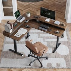 a computer desk with a chair and laptop on it in the middle of a room