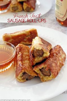 french toast sausage rolls on a plate with dipping sauce