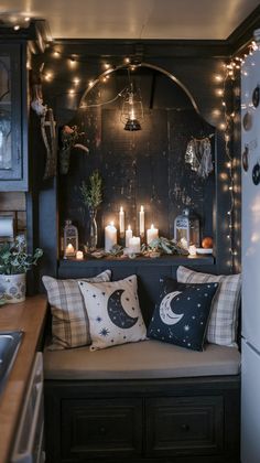 a couch with some candles on top of it in front of a refrigerator freezer