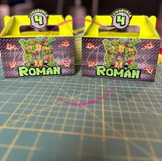 two boxes with teenage mutant stickers on them