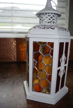 Stained glass honey comb lantern with 4 inch flickering LED candle. 12 inches tall! Lampwork bee added to one side. Honeycomb Lantern, Stained Glass Candle Holders, Glass Lanterns, Stained Glass Candles, L'art Du Vitrail, Lantern Ideas, Glass Diy, Making Stained Glass, Glass Bottles Art