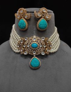 Turquoise Kundan Choker Necklace, a tribute to Sabyasachi's style. This Polki Choker and Jadau Jewelry ensemble exudes opulence, showcasing the allure of Kundan Bridal Jewelry. The Kundan Choker Set celebrates tradition and artistry, reflecting regal charm. Indulge in the resplendent beauty of this jewelry set, where every piece captures the essence of Kundan and Polki craftsmanship, creating a captivating blend of elegance and cultural richness. Please choose The color of Your choose 😊 Customized orders takes 3 to 4 weeks, depending on piece requirements.  The Ombre Designs Jewelry pieces can be customized in accordance with your requirement.  Please Email or Whats app on : +91 8448833193 / sonalikamehra@theombredesigns.com Traditional Turquoise Bridal Necklace As A Gift, Turquoise Kundan Bridal Necklace For Festive Occasion, Festive Turquoise Kundan Bridal Necklace, Traditional Turquoise Necklace For Celebration, Turquoise Meenakari Necklace For Wedding, Elegant Turquoise Jewelry With Stone Work, Turquoise Necklace For Festive Occasions, Festive Turquoise Necklace For Gifts, Turquoise Jewelry With Stone Work For Gift