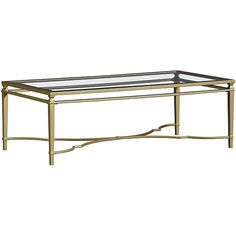 a gold coffee table with glass top