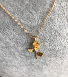 "Gorgeous Rose Necklace! You choose a 16\" or 18\" delicate yet sturdy 14k gold filled chain that holds a detailed rose pendant. (Length pictured is 18\"). On trend, it's my new favorite piece I haven't taken off! Charm measures roughly 17 mm x 40 mm and is 24k gold filled over copper. Excellent detail in this tiny piece! Arrives in a gift box! *if you need an item sooner, please message me! I am happy to ship sooner if I'm able to ❤️" Elegant Gold Charm Necklace With Rose Design, Dainty Rose Gold Necklace With Rose Design, Rose Gold Charm Necklace With Flower Pendant, Dainty Rose-colored Jewelry With Rose Design, Rose Gold Flower Charm Necklace With Delicate Chain, Delicate Rose Gold Necklaces With Roses, Gold Flower Pendant Jewelry With Roses, Gold Rose Pendant Jewelry, Gold Necklaces With Rose Flower Pendant