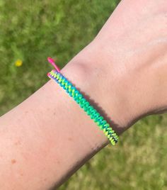 Fun rainbow macrame adjustable bracelet. Made with 0.8mm nylon cord (not waxed). Standard size if different size is not requested best fits wrist circumference of 6-7.25 inches. Other sizes can be made at no additional charge, just send me a message. Adjustable Rainbow Friendship Bracelets With Sliding Knot, Adjustable Rainbow Bracelet With Cord, Rainbow Sliding Knot Bracelets For Friendship, Rainbow Adjustable Cord Jewelry, Rainbow Jewelry With Adjustable Cord, Rainbow Friendship Bracelets With Sliding Knot, Rainbow Sliding Knot Bracelet For Friendship, Rainbow Sliding Knot Friendship Bracelet, Resizable Rainbow Friendship Bracelets