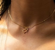 Elevate your style with our Personalized Heart-Shaped Initial Letter Necklace, a stunning 18k gold-plated accessory designed for teens and girls. This heart necklace isn't just a piece of jewelry; it's a symbol of individuality.  Personalize it with the letter that means the most to you, creating a unique and meaningful keepsake. Crafted with precision, this necklace is a perfect blend of elegance and personal touch. Embrace the beauty of self-expression with our Heart Necklace - a cherished gift for any occasion HOW TO ORDER: -->Write your preferred letter in the personalization box --> Complete the purchase VARIATIONS: Color options: 18K Gold Plating Length: 45cm PRODUCT FEATURES: ✨ Handcrafted Brilliance: Each of our Initial Name Letter Necklaces is painstakingly crafted by hand, showca Initial Letter Necklace, Necklace For Women Gold, Gold Letter Necklace, Stainless Steel Chain Necklace, Heart Shaped Necklace, Handmade Heart, Birthday Jewelry Gift, Letter Pendants, Personalized Initials