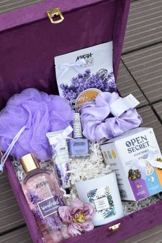 an open purple suitcase filled with beauty products