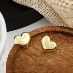 Solid 18k gold-plated heart stud earrings. 0.74" W x 0.66" H 18k gold-plated copper Heart Stud Earrings, Heart Studs, Heart Earrings Studs, 18k Gold, Copper, Plating, Stud Earrings, Gold, Bonito