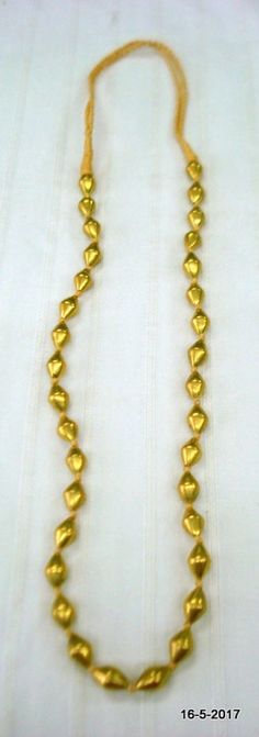 Vintage antique tribal old 22kt Gold Beads Necklace mala from Rajasthan India. great handmade design good for jewellery collection.Note - There is wax inside the gold beads. Gold Beads are filled with wax inside. Length - 79 cm (31") we can adjust the Length. Size of each bead (approx) - 1.3/0.7 cmGross weight - 24.5 grams Material - 22kt Yellow Gold,wax inside. Gold Kundan Necklace For Puja In 22k Gold, Gold 22k Kundan Necklace For Puja, 22k Gold Beads Jewelry For Festivals, 22k Gold Beaded Jewelry For Festivals, 22k Gold Beads Ceremonial Jewelry, Handmade Yellow Gold Necklace For Diwali, Gold Spiritual Temple Necklace For Celebrations, Yellow Gold Necklace With Latkans For Puja, Gold Temple Necklace With Gold Beads For Diwali