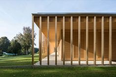 an open air shelter with wooden slats on the sides