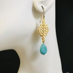 A decorative handicraft art began from the most prosperous Tang Dynasty in China, Chinese Knot is actually inspired by how Chinese inherited the civilization from the divine: They use knots as a record of their life and history when character were not developed in very ancient times. ⚜Item Specifics❀ Gold Plated Chinese Knot and Ear Wire❀ Turquoise Howlite Teardrop❀ Earring Length Measures 3.5 inch Adjustable Drop Earrings With Artistic Design, Traditional Artistic Design Drop Earrings, Bohemian Teardrop Jewelry With Artistic Design, Traditional Turquoise Jewelry For Gift, Handmade Turquoise Jewelry For Ceremonial Occasions, Handmade Ceremonial Blue Jewelry, Artisan Turquoise Brass Jewelry, Elegant Turquoise Brass Jewelry, Traditional Turquoise Earrings As A Gift