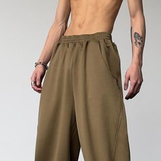 For a fashionable and eye-catching appeal during outdoor strolls, invest in this retro-styled hip-hop trouser for men that is designed with a high waist and wide legs. The full-length bottom is made from a broadcloth fabric using high-quality cotton and polyester materials. It's loose clothing with a desirable elastic closure for perfect fitting.Specifications Waist Type: HIGH Thickness: Midweight Style: Casual Pant Style: Sweatpants Origin: Mainland China Model Number: 2022/15J89 Material: Poly Retro Baggy Pants For Fall, Baggy Wide Leg Hip Hop Harem Pants, Baggy Wide Leg Harem Pants Hip Hop Style, Wide Leg Parachute Pants For Summer Outdoor Activities, Summer Wide Leg Parachute Pants For Outdoor, Summer Outdoor Wide Leg Parachute Pants, Hip Hop Style Parachute Trousers For Summer, Hip Hop Parachute Trousers For Summer, Retro Streetwear Pants For Fall