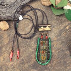 Handmade Artistic Wooden Symbol Necklace 🖌️🎨🌿 📋 Materials: Leather, Wood, Ceramic 📏 Length: Adjustable 19.6 inches/50cm  Pendant Widht: 1.9inches / 5cm Pendant Lenght: 3.9inches / 10cm  🌟 Unique: This necklace is one-of-a-kind, meaning the owner will possess the only piece in existence. Discover the beauty of handmade jewelry with our artisan pendant necklace. Featuring a unique ceramic pendant, this boho necklace showcases exquisite craftsmanship. Perfect as a birthday gift or a special g Handmade Brown Necklaces For Rituals, Bohemian Hand Painted Necklaces For Festivals, Traditional Necklace With Adjustable Cord As Gift, Handmade Amulet Necklaces For Festivals, Unique Hand Painted Necklaces For Festivals, Handmade Amulet Necklace For Festivals, Vintage Necklace With Adjustable Cord For Festivals, Bohemian Hand Painted Festival Necklaces, Traditional Hand Painted Festival Necklaces