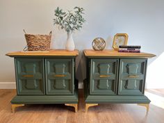 two green dressers side by side on wooden floors