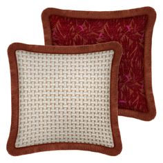 two red and white pillows with brown trimmings on them, one in the shape of a square