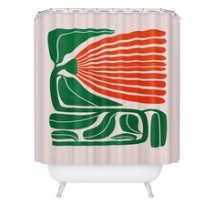 a shower curtain with an orange and green design on it