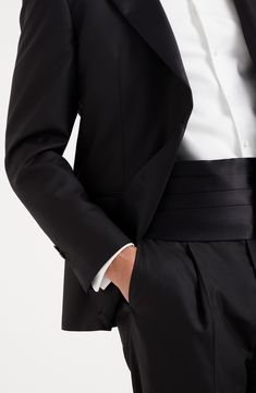 The cotton and silk satin employs the same fabric that decorates the tuxedo lapels, with a smooth texture and slightly shiny effect. Adjustable slide fastening Classic Satin Business Suit, Classic Satin Suits For Semi-formal Occasions, Tailored Satin Elegant Suit, Timeless Wedding Tuxedo With Hidden Button Closure, Classic Evening Suits For Gala, Classic Tailored Satin Suits, Classic Formal Tuxedo With Structured Boning, Elegant Fitted Satin Tuxedo, Elegant Tailored Tuxedo With Hidden Button Closure