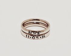 "These Stainless Steel rings are super shiny and a petite 3 mm wide, with a rounded edge. The letters y, p, and j do NOT do well on this rounded ring therefore I suggest if you have these letters in your name that you order the 3 mm flat ring available on my page. These rings are comfortable for stacking up to 4 rings. I can personalize with names, dates, quotes or roman numerals or scripture. Great to wear with your diamond or use as a thumb ring also. These rings also come in Gold and Rose Gol Custom Name Adjustable Open Ring, Dainty Personalized Initial Ring With Round Band, Personalized Dainty Initial Ring, Dainty Personalized Initial Ring, Adjustable Personalized Stackable Rings, Dainty Stackable Engraved Open Ring, Hand Stamped Stackable Rings For Promise, Personalized Minimalist Stackable Rings, Minimalist Personalized Stackable Round Rings