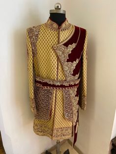 Pure jamevaar sherwani with velvet patch enhanced with hand zardoshi work for grooms wear . ( can be customised in different colours matching to bridal wedding outfit ) Includes- sherwani with bottom. Gold Bollywood Bandhgala For Traditional Ceremonies, Long Bandhgala For Traditional Ceremonies And Festivals, Traditional Drape Nehru Jacket For Ceremonies, Red Traditional Churidar With Naqshi Details, Fitted Bollywood Style Kurta For Traditional Ceremonies, Bollywood Style Traditional Wear With Naqshi, Bollywood Style Sets With Naqshi For Traditional Ceremonies, Transitional Nehru Jacket For Traditional Ceremonies, Fitted Kurta With Dabka For Traditional Ceremonies