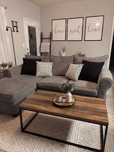 a living room with two couches and a coffee table in front of the couch