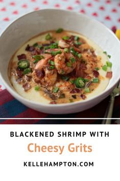 a white bowl filled with shrimp and grits on top of a checkered table cloth